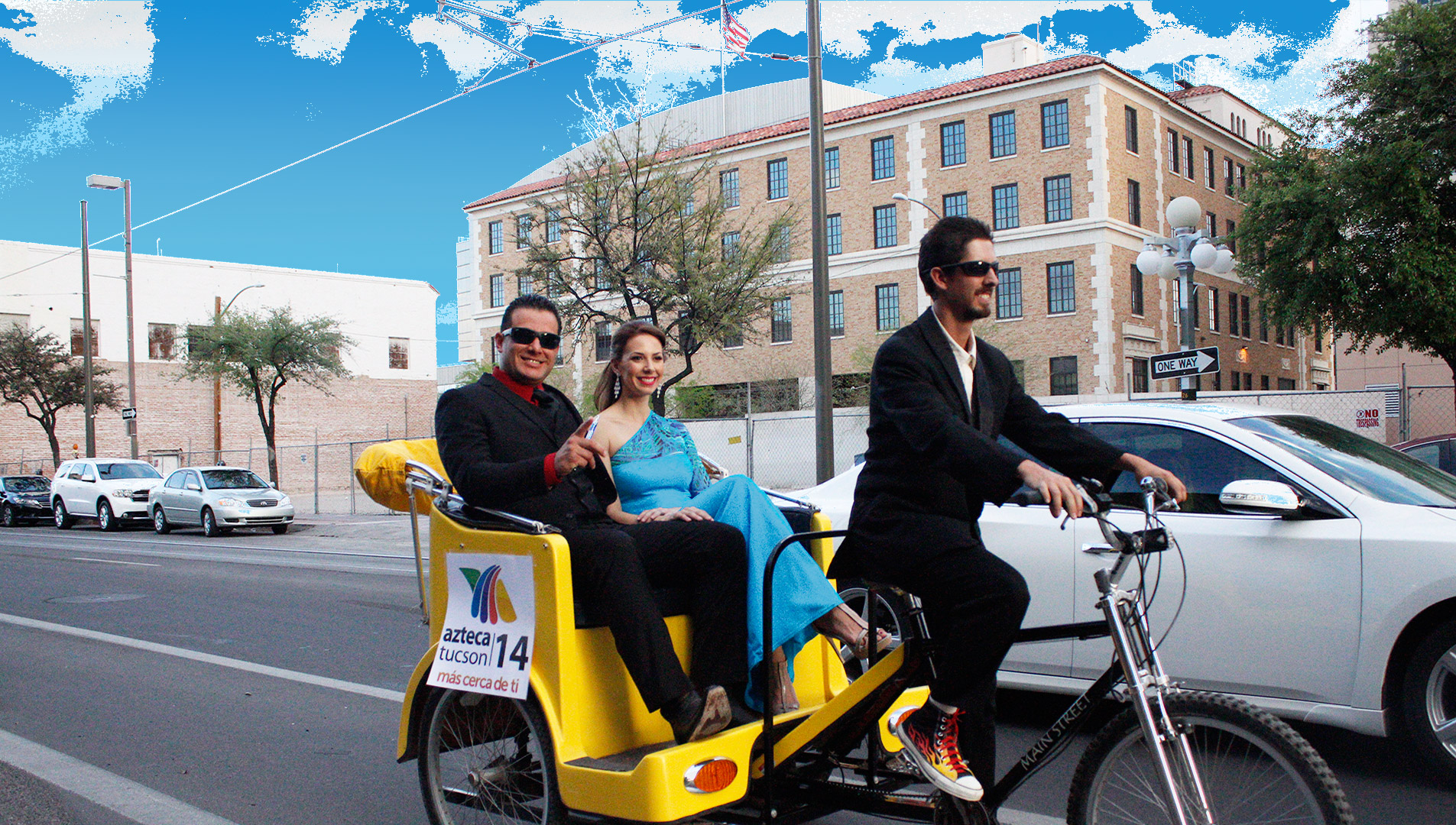 A young couple gets a ride through downtown Tucson on a pedicab.
