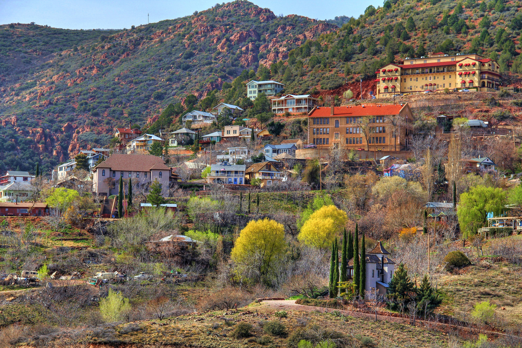 Colorful old buildings cling to the hillside in the mining ghost town of Jerome, Arizona.